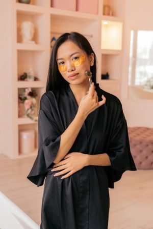 woman using face roller